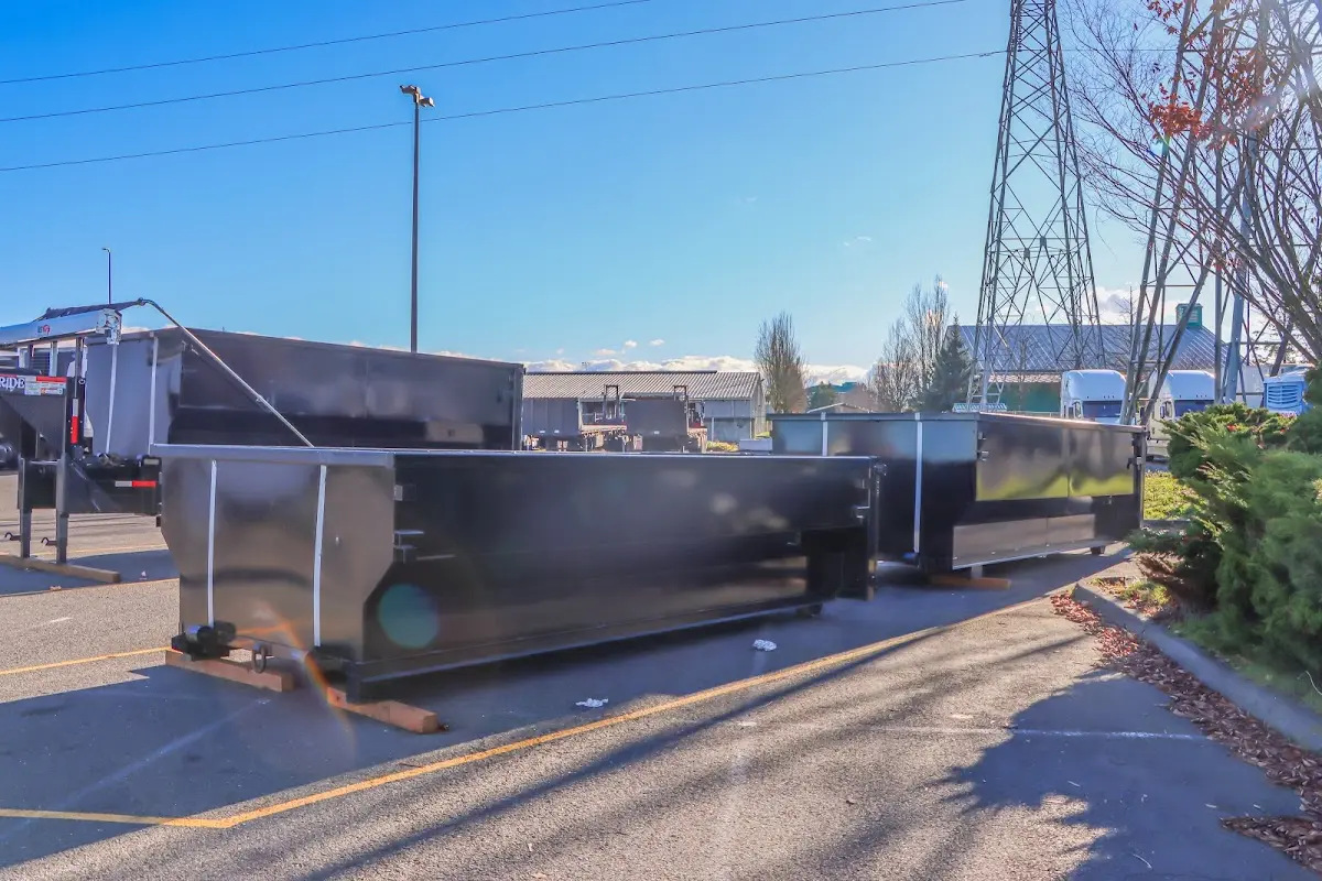 Roll-off dumpster ready for waste disposal at job site for 3 Yard Dumpster Rental in Byram